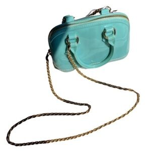 Turquoise Tempest: The Deluxity LA Crossbody with‎ a Golden Twist